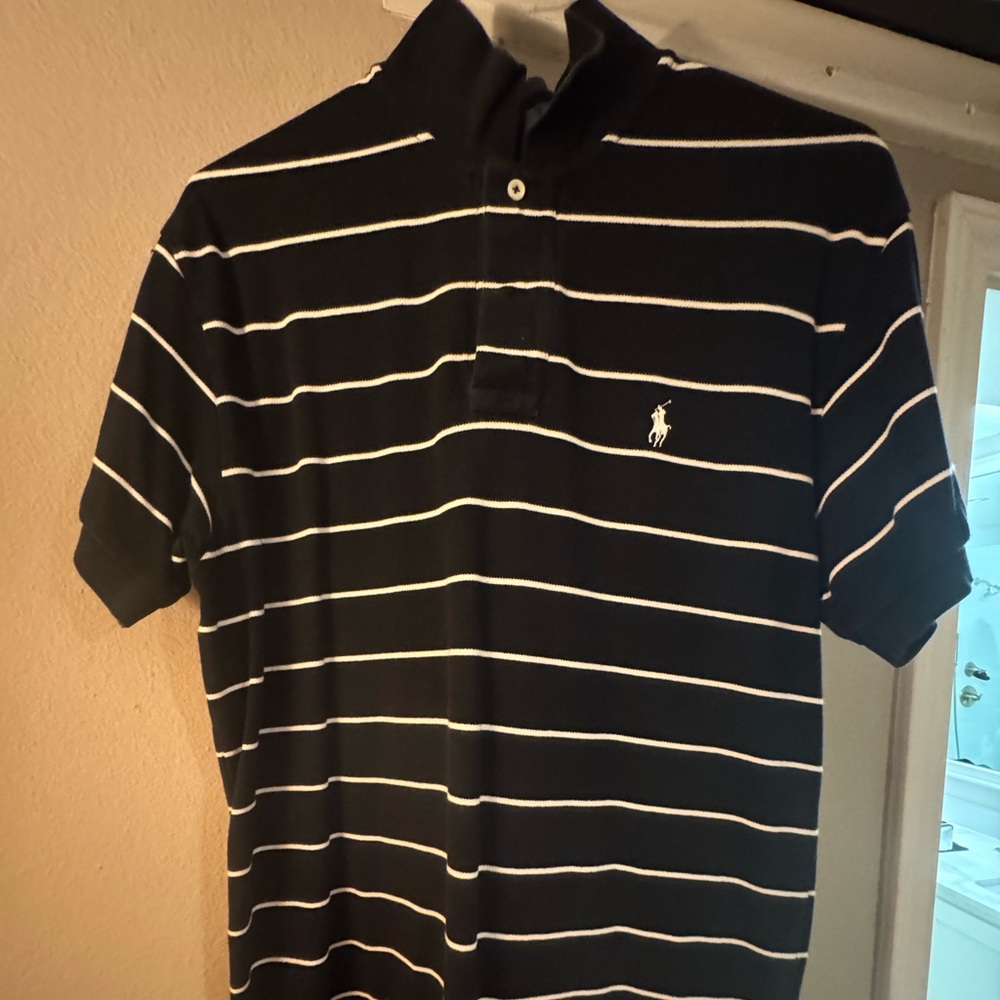 Medium black polo with white strips. Great condition